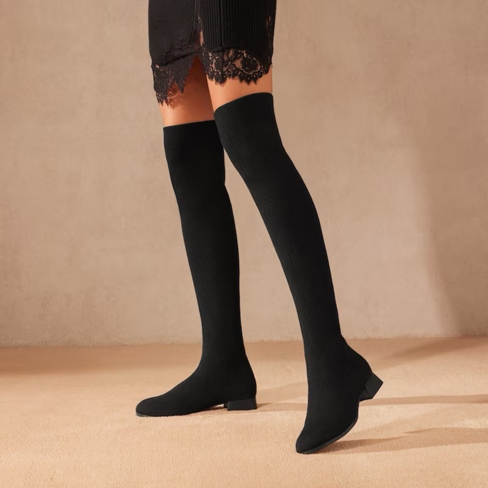 Thigh-High Black Vivaia Boots.